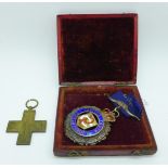An Italian Nationalist March on Rome cross medal, 1920-1922, and a silver Buffalo lodge medal