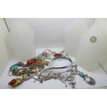 Assorted statement necklaces and stands