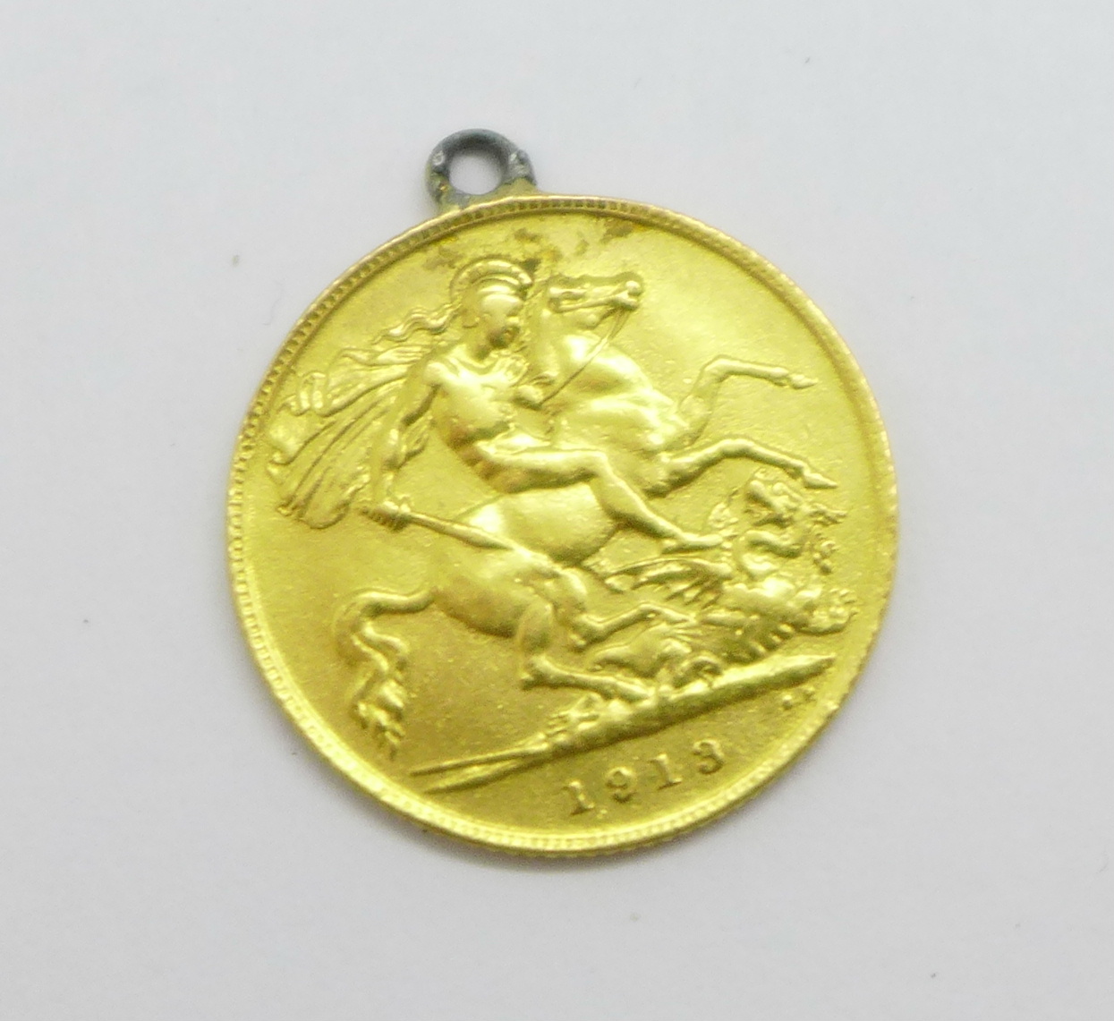 A George V 1913 half-sovereign with attached loop, a/f