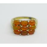 A silver gilt and fire opal ring, L