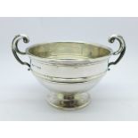 A silver two handled bowl, Birmingham 1911, 100g, diameter 9.5cm