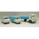 A Corgi Toys Co-operative Society set, Commer van, milk float and flat-bed lorry