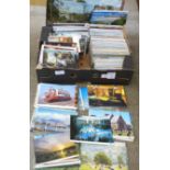 A box of vintage to modern postcards