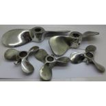 Five metal propellers, largest 26cm