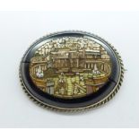 A micro-mosaic brooch, St. Peter's Square, (a/f, repaired, black border cracked, backing damaged)