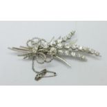 A white metal and diamond set spray brooch, circa 1890, over 4ct diamond weight, tests as 18ct gold,