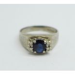 An 18ct white gold, sapphire and diamond ring, 4.7g, N