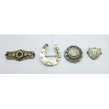 Two Victorian hallmarked silver brooches, one horseshoe and one with gold applied decoration, a