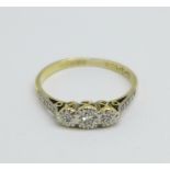 An 18ct gold, three stone diamond ring, 2.5g, P