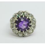 A platinum set, amethyst and diamond cluster ring, approximately 1.5ct diamond weight, 5.9g, M, (
