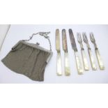 A plated chain mail purse and a set of three mother of pearl handled knives and forks