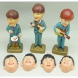 Three The Beatles nodding head figures and four plastic Beatles heads