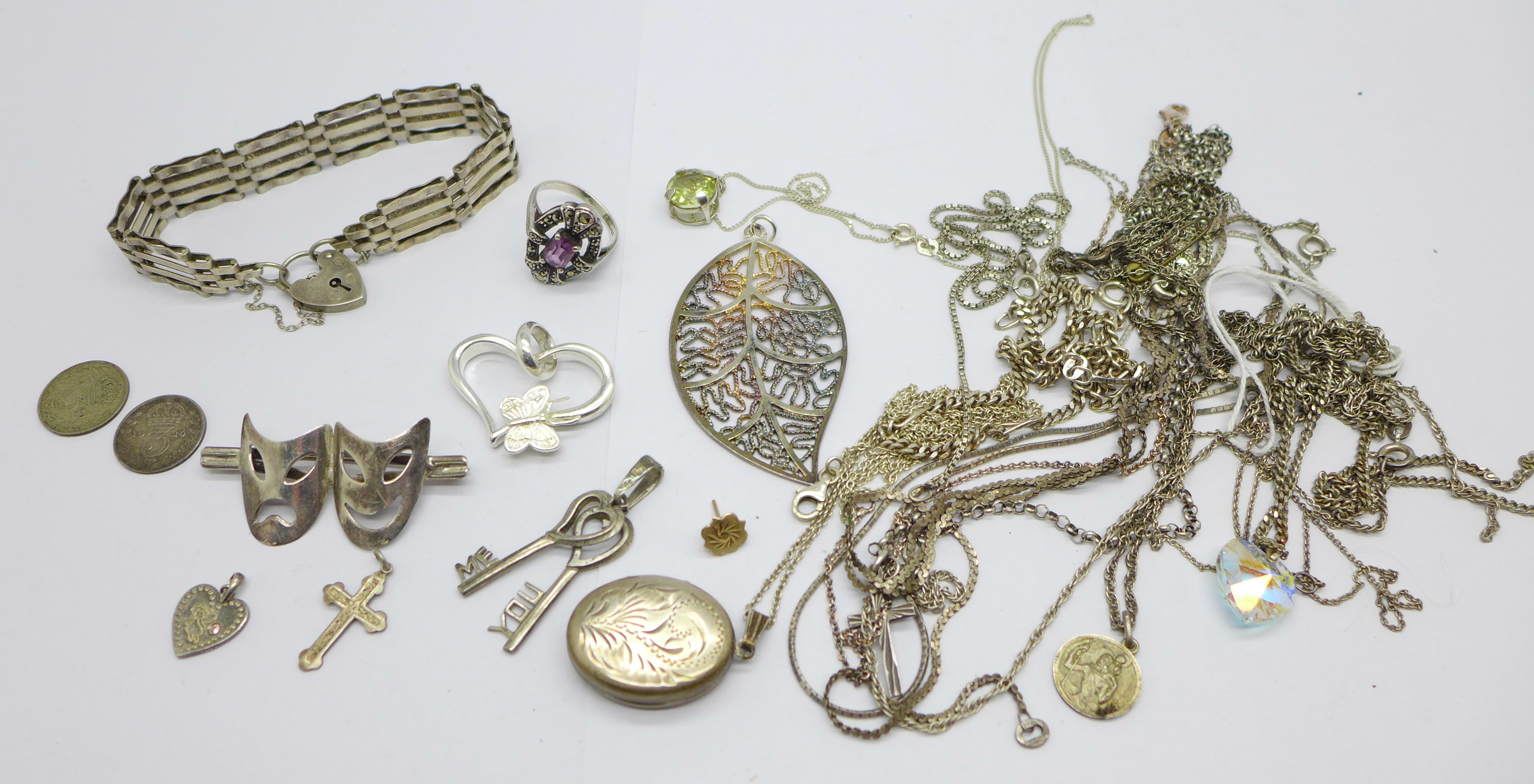 Jewellery including a silver gate bracelet, a silver locket, a 925 silver mask brooch, silver