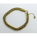 A yellow metal fancy link bracelet, 12.3g, (requires safety chain repair and a new fastener)