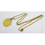 A Victorian 1887 £2 coin with attached yellow metal mount, suspended on a yellow metal chain,