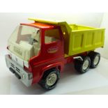 A Tonka Toys vintage pressed steel XR-101 dump or tipper truck renovated with red and yellow