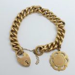 A 15ct gold bracelet with a 9ct gold fob medal charm, total weight 42.5g, marked 15ct on padlock and