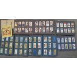 Seven complete cigarette card albums, in sets, many themes, approximately 1,000 cards in total