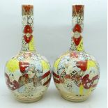 A pair of Satsuma bottle vases, 19cm