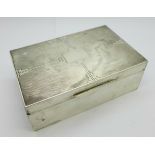 A silver Art Deco cigarette box, London 1937, William Comyns & Sons Ltd., width 14cm