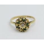A 9ct gold, emerald and diamond cluster ring, 1.6g, K