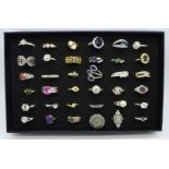 Thirty-six dress rings in a display box
