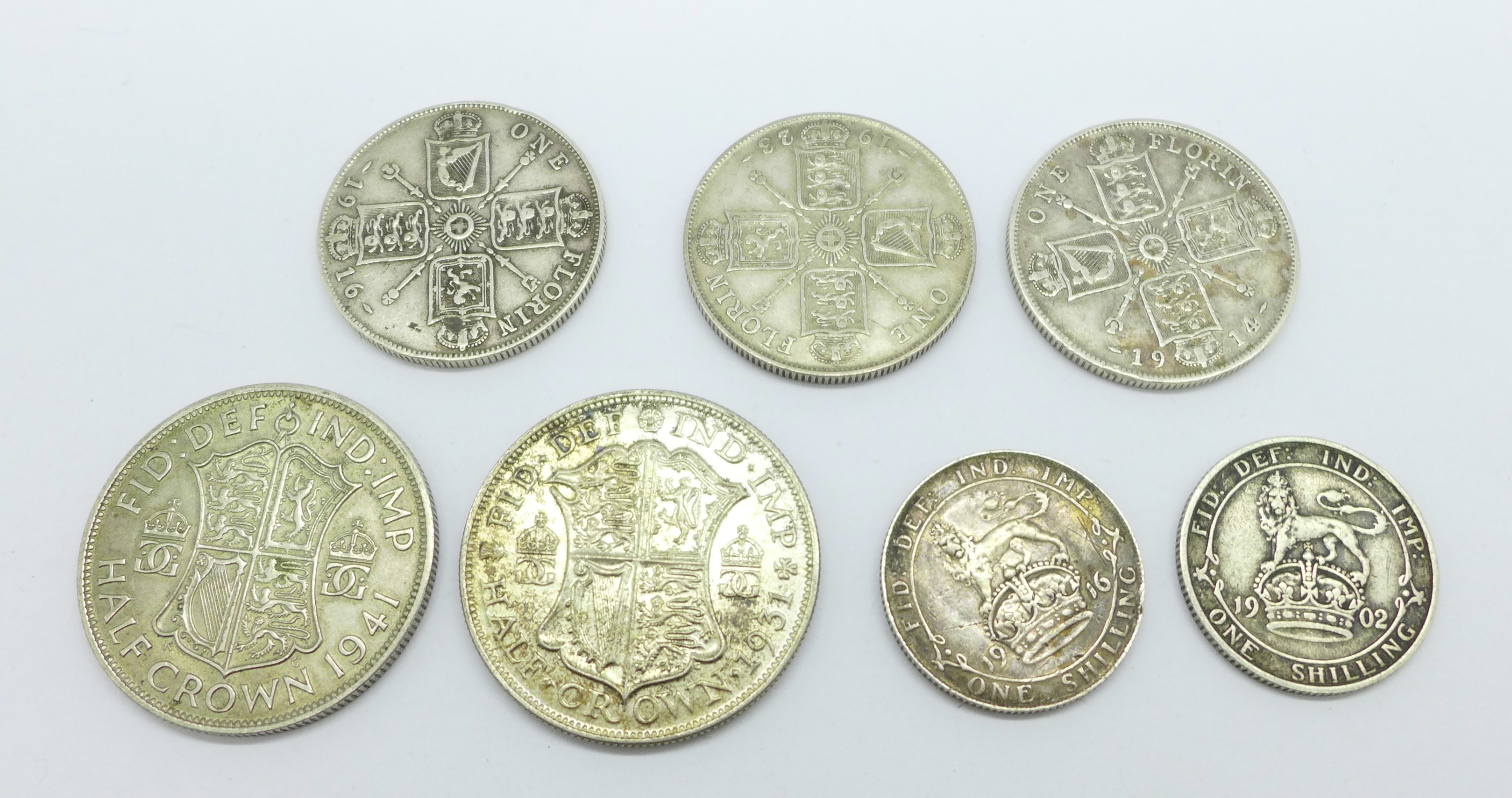 Seven coins; two half-crowns, 1931 and 1941, three florins, 1914, 1916 and 1923, and two