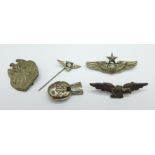 A sterling silver United States Parachute badge, a tin Etiopia-Italiana badge, a German WWII