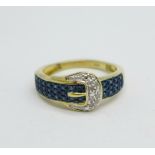 A silver gilt buckle ring, set with diamonds, Q