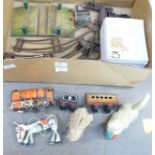 A tin-plate train set with track, level crossing, a Muffin the Mule cast metal puppet, a clockwork