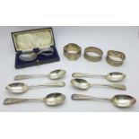 A set of six silver teaspoons with bright cut decoration, a silver baby's feeding spoon and three