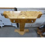 An Art Deco style maple effect three drawer console table