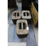 Three cast iron weights