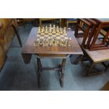 A Victorian style inlaid mahogany and yew wood games table