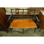 An Edward VII inlaid mahogany salon settee and an occasional table