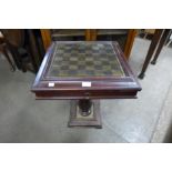 A brass topped hardwood games table