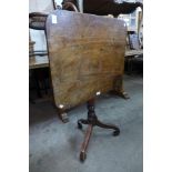 A Victorian mahogany rectangular tilt-top tripod table