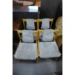 A set of four Ercol 775A model beech and upholstered chairs