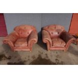 A pair of Thomas Lloyd brown leather Chesterfield style armchairs