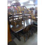 An oak refectory table and six beech wheelback chairs
