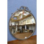 A 1920's brass framed circular mirror
