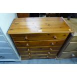 A pine chest of drawers and matching bedside chest