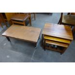 A teak nest of tables and a copper topped coffee table