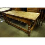 A carved oak coffee table, a mahogany drop-leaf occasional table and one other