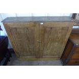 A Victorian pine two door cupboard