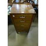 An oak chest of drawers