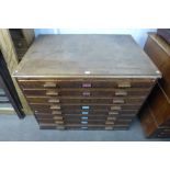 An early 20th Century pine eight drawer plan chest