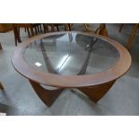 A G-Plan Astro teak and glass topped circular coffee table