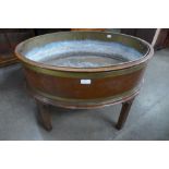 A Regency style mahogany and brass oval wine cooler