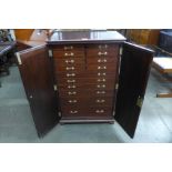 A mahogany fitted fourteen drawer collector's cabinet